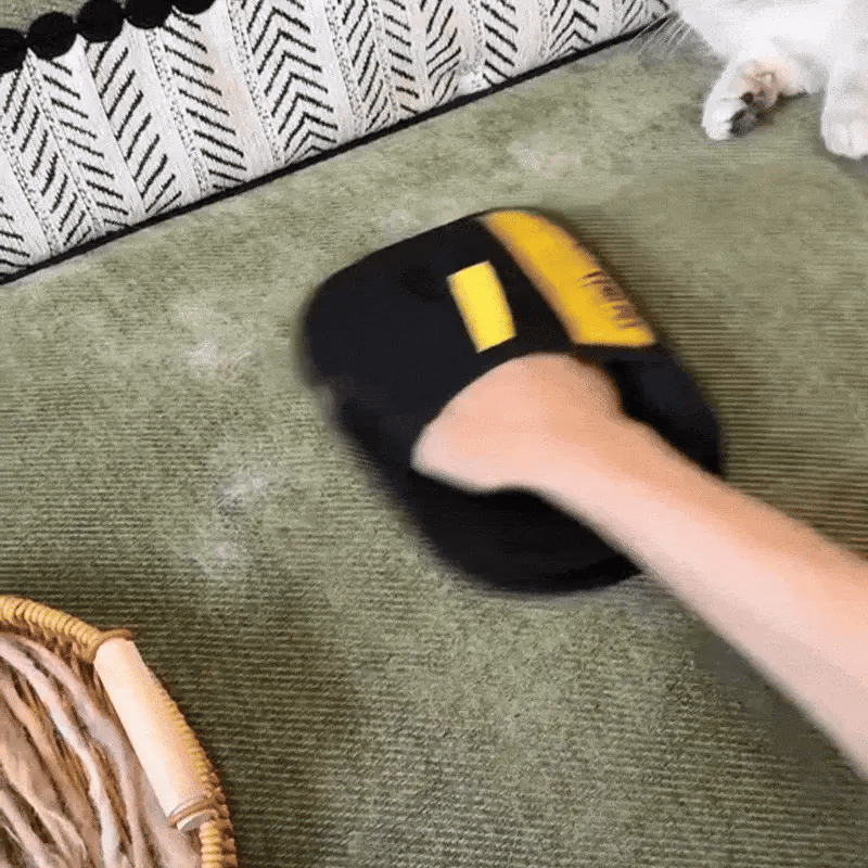 Groomify™ glove lifting pet hair in one swipe on upholstery for fast, mess-free cleaning.